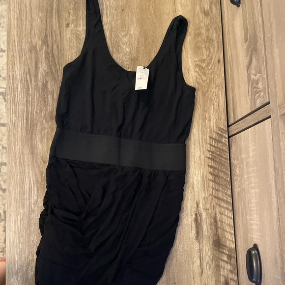 Black form fitting ruffled bottom styled dress - Picture 1 of 4